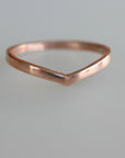 A simple gold v-shaped ring