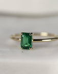 A gold ring with a green emerald gemstone in a rectangular shape. Emerald Ring 14k Gold, Emerald Cut Emerald Engagement Ring Handmade, Minimalist Modern Gemstone Ring, 20th Anniversary Ring, May Birthstone