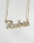 14K solid gold nameplate necklace with real diamonds on a silk background.