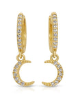 14k gold crescent moon earrings with pave diamonds hanging from small huggie hoops, shown on a white background in a flat lay style.