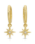 Gold hoop earrings with a dangling star charm featuring a small clear stone in the center.