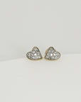 A pair of gold heart-shaped earrings with small diamonds set in the heart.