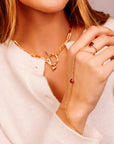 Model showing gold garnet slave bracelet on hand, minimalist gemstone jewelry for special occasions