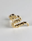 A gold snake-shaped earring. The snake is curled up with its head facing the viewer.