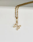 14k solid gold zodiac necklace with a sparkling CZ diamond accent, featuring a Cancer symbol pendant on a delicate gold chain, displayed on a white background.