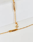 Custom gold filled bar bracelet with a child’s name engraved, shown on a white background. Dainty and personalized baby jewelry.