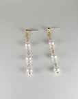 Close up of freshwater pearl drop earrings with zircon stud and gold filled chain
