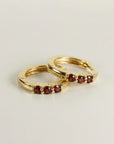 14k yellow gold garnet huggie hoop earrings with three 2mm stones
