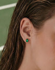 14k gold emerald cut emerald stud earrings, genuine green gemstone fine jewelry, worn on ear.