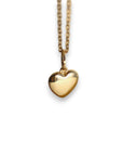A 14k solid gold heart-shaped pendant hangs from a delicate gold chain.