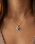 Heart aquamarine necklace worn on neck, delicate jewelry.