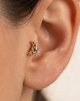 14k solid gold croissant flat back cartilage earring worn in tragus piercing, cute food themed minimalist stud