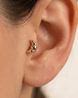 14k solid gold croissant flat back cartilage earring worn in tragus piercing, cute food themed minimalist stud