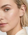 14k gold flat back moon earring with cubic zirconia, small cartilage piercing jewelry gift worn by a model