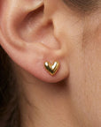 14k solid gold puffy heart flat back earring worn in tragus piercing, dainty everyday ear stack stud