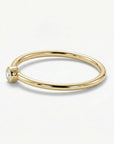 Minimalist 14k gold diamond ring with small round solitaire diamond on dainty band, elegant stacking ring