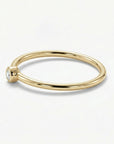 Minimalist 14k gold diamond ring with small round solitaire diamond on dainty band, elegant stacking ring