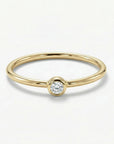 Dainty 14k gold diamond solitaire ring with tiny round diamond on thin band, minimalist stacking promise ring