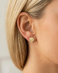 Hammered gold filled disc stud earrings worn on model, minimalist geometric circle posts, close-up