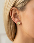 Hammered gold filled disc stud earrings worn on model, minimalist geometric circle posts, close-up