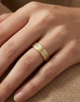 14k gold diamond starburst eternity wedding band worn on finger, celestial starburst diamond stacking ring for wedding or anniversary