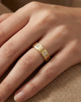14k gold diamond starburst eternity wedding band worn on finger, celestial starburst diamond stacking ring for wedding or anniversary