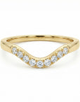 Curved diamond wedding band in 14k gold, organic contour half eternity ring flat lay on neutral background