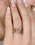 Woman wearing dainty 14k gold rose cut diamond ring, minimalist engagement band