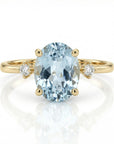 Oval aquamarine engagement ring in 14k gold with diamond accents