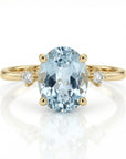 Oval aquamarine engagement ring in 14k gold with diamond accents