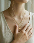 minimalist diamond heart necklace on model paperclip chain