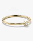 Tiny diamond solitaire ring in 14k gold on delicate band, minimalist diamond stacking ring for everyday wear