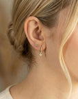 woman wearing pink tourmaline flower earrings colorful gemstone cluster studs