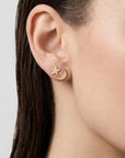 Model wearing 14k solid gold moon and star stud earrings, dainty celestial jewelry with crescent moon and tiny star design