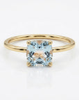 Cushion cut aquamarine ring in 14k gold with floral basket setting close up
