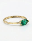 marquise green gemstone ring detail shot polished 14k gold