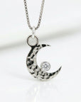 14k white gold diamond crescent moon necklace close up hammered texture celestial jewelry