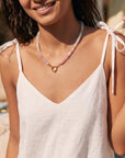 Moonstone necklace worn at the neckline, showing 20 inch length and gold filled figure eight clasp at the front.