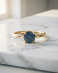 Montana Sapphire Ring 14k Gold, Blue Sapphire Solitaire Engagement Ring, Minimalist Promise Jewelry, September Birthstone Gift for Her shown in an AI-generated listing photo
