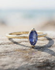 Handmade Marquise Blue Sapphire Ring: 14k Yellow Gold September Birthstone Jewelry shown in an AI-generated listing photo