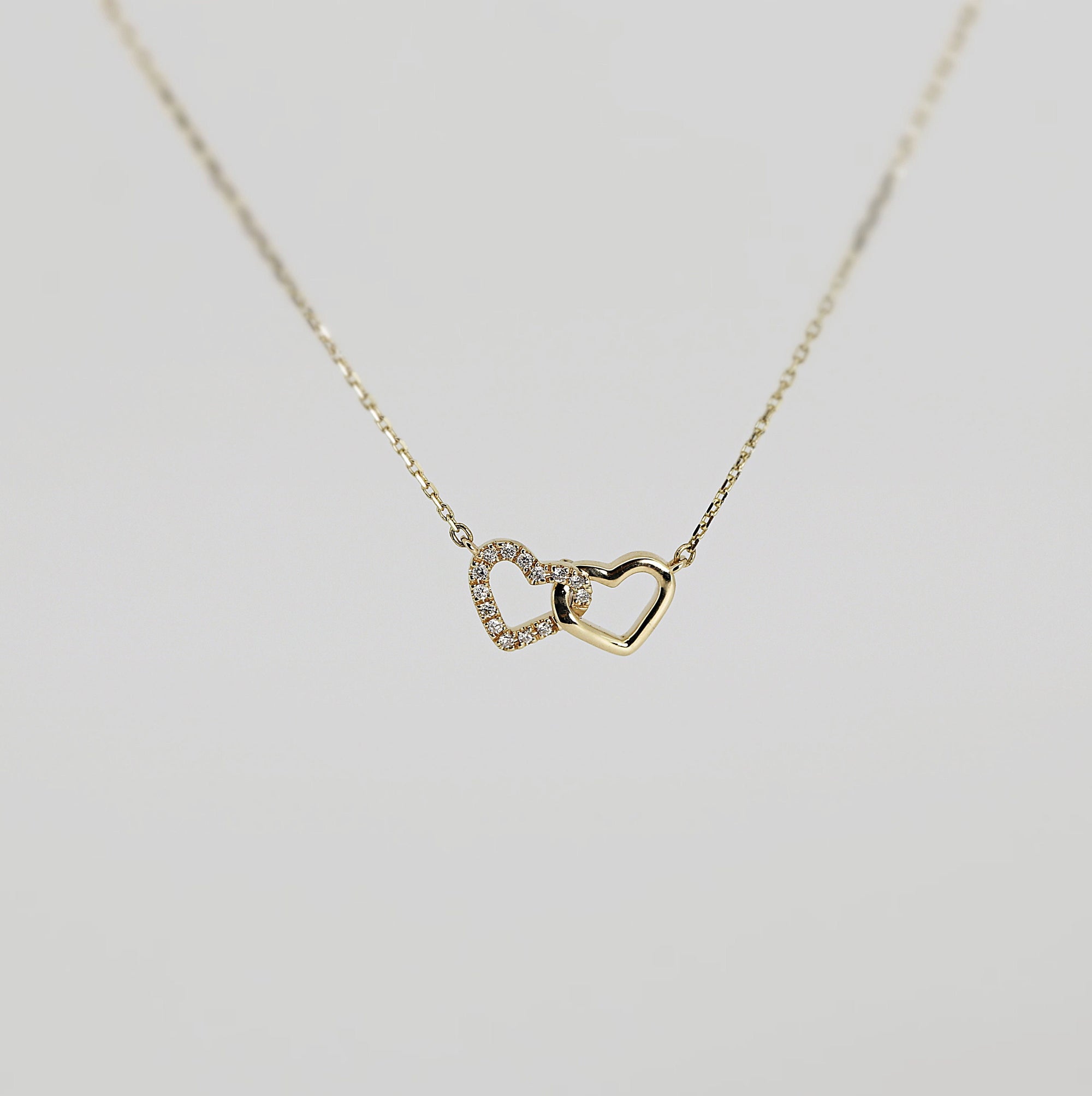 14k Gold Diamond Interlocking Two Hearts Necklace