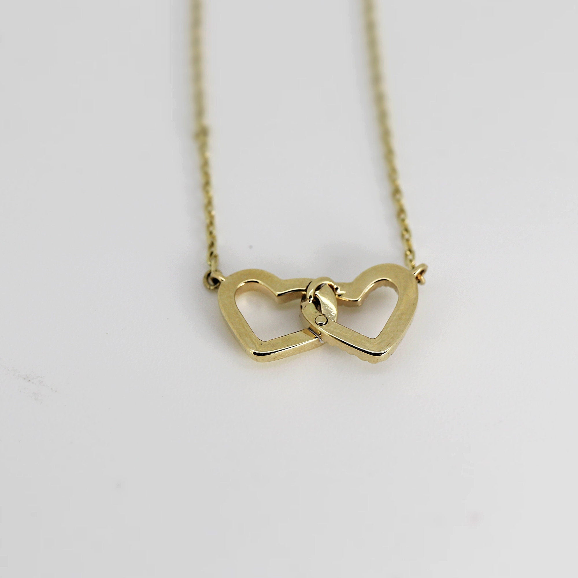 14k Gold Diamond Interlocking Two Hearts Necklace