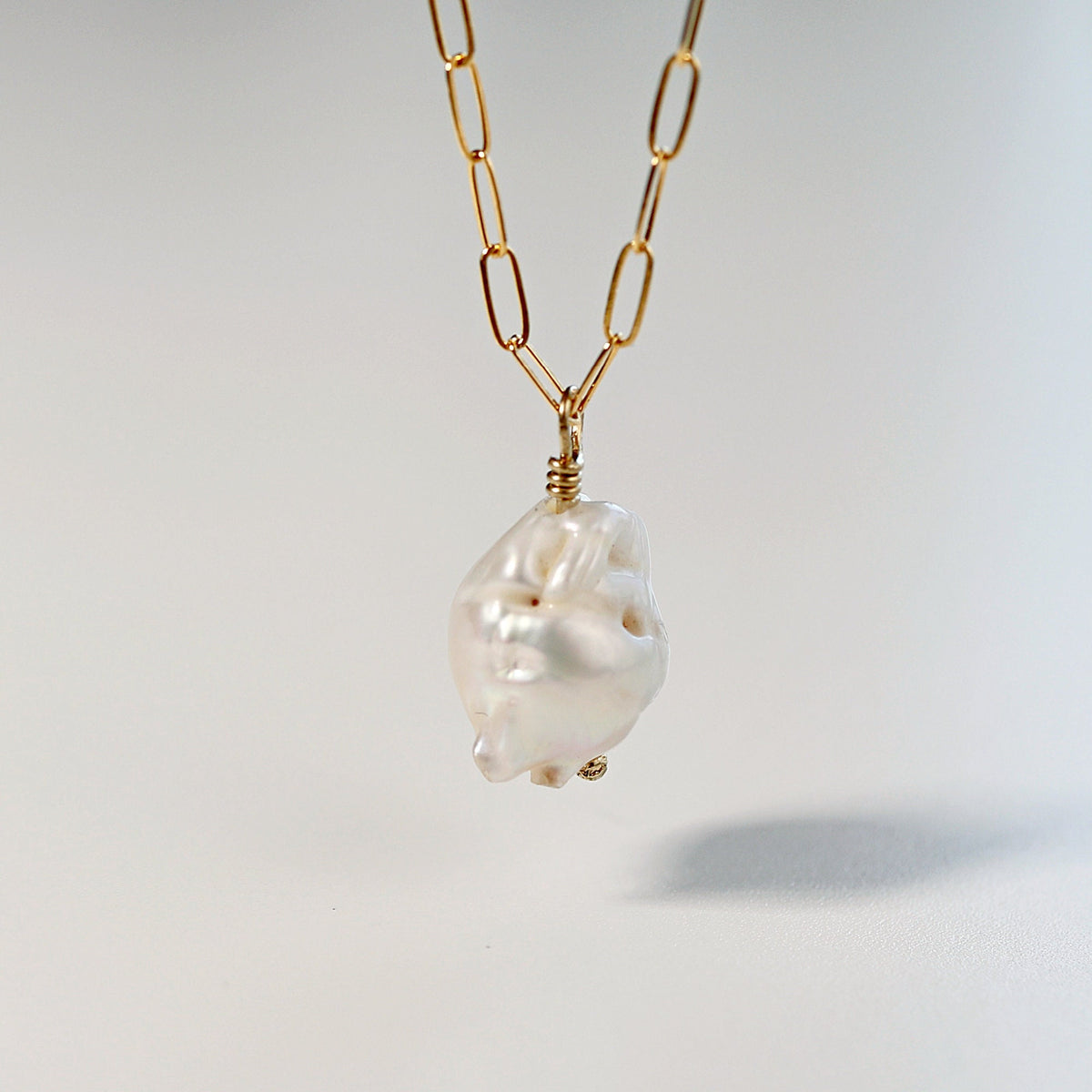 A gold chain necklace with a large, white baroque pearl pendant. Baroque Natural Pearl Necklace, Freshwater Pearl Necklace Gold Filled, June Birthstone, Layering Necklace, Bridal Jewelry Best Friend Gift