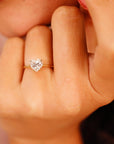 A gold ring with a heart-shaped moissanite.