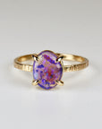 14k solid gold ring featuring a natural purple Australian opal, displayed on a white background with vibrant flashes of color
