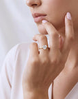 Model wearing Heart cut Moissanite Ring in 14k Gold.