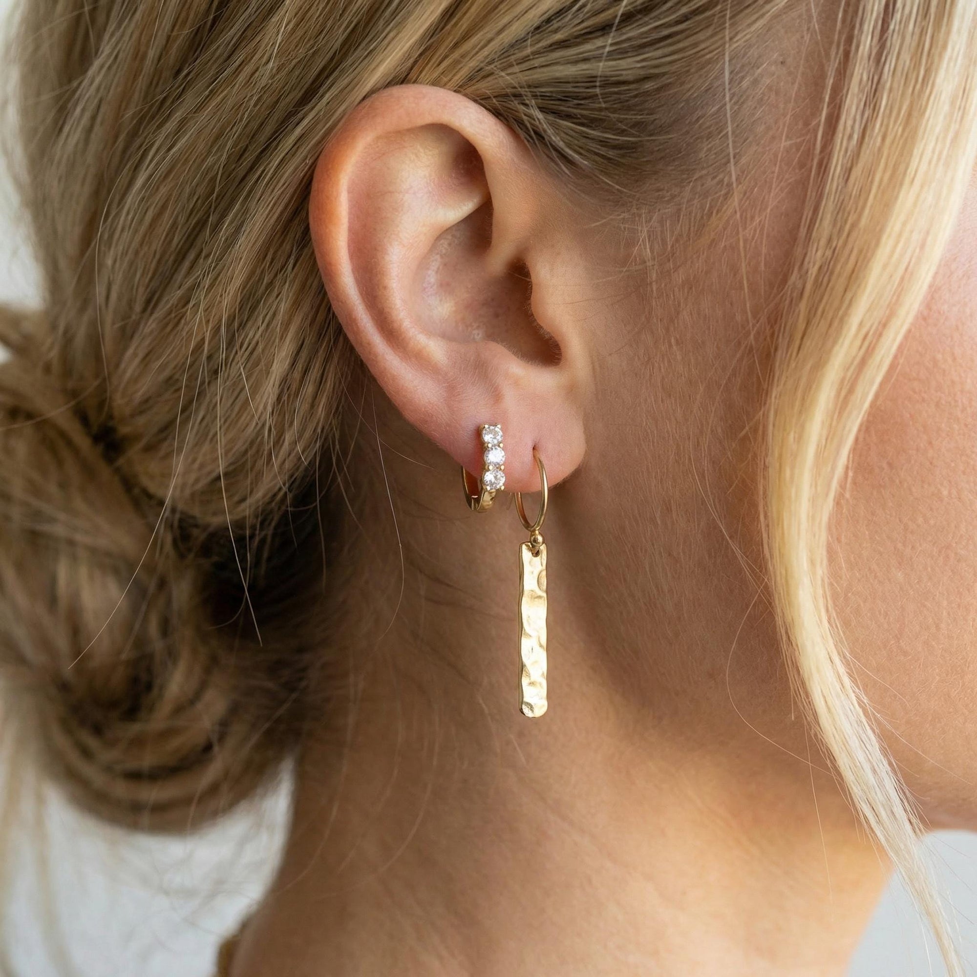 Gold filled hammered bar dangle earrings worn on model, minimalist gold bar drop earrings