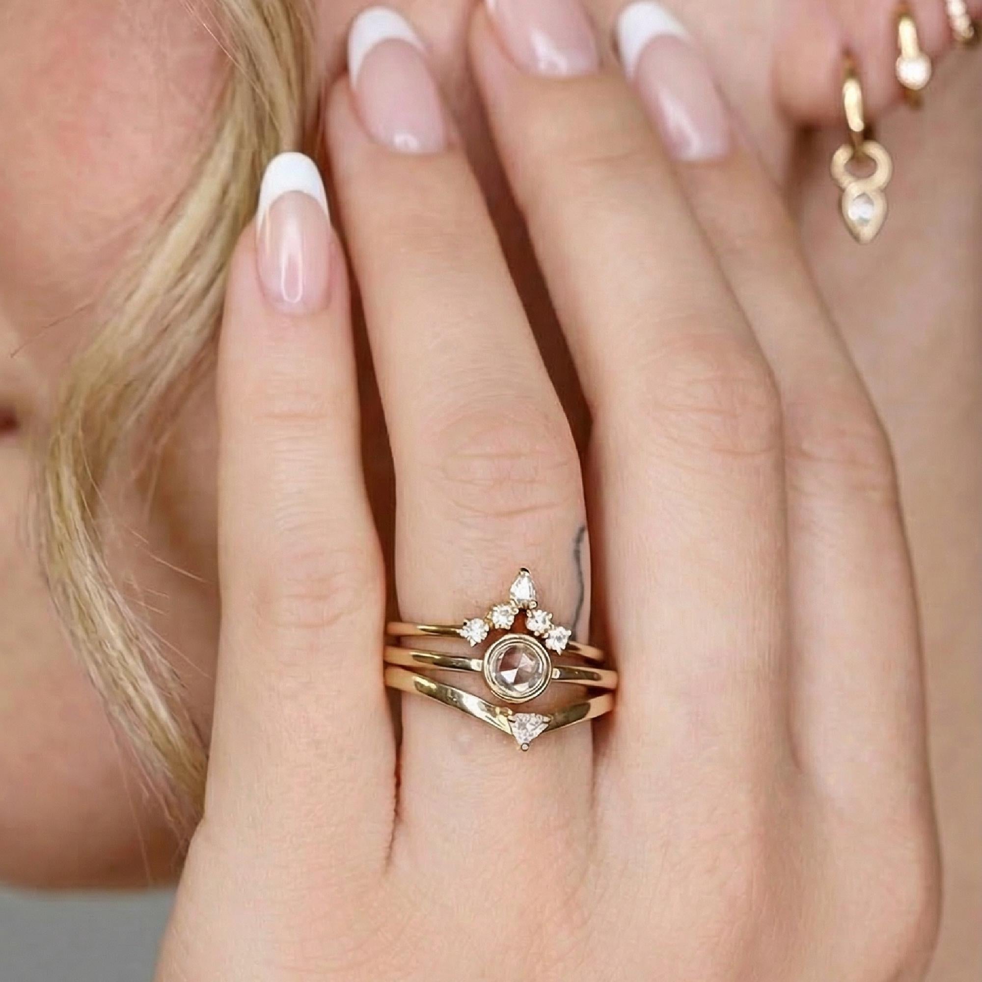 Woman wearing dainty 14k gold rose cut diamond ring, minimalist engagement band