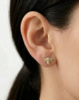 gold bee stud earrings with diamonds worn on ear, nature inspired dainty jewelry for women