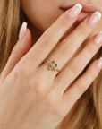 floral gold ring with garnet emerald ruby opal pearl sapphire stones handmade cherry blossom design worn by a woman